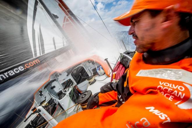 Team Alvimedica - Out of the doldrums,the pace quickens for the fleet on the race south to a light-wind trough of low pressure and the Vanuatu wind shadow. Alberto Bolzan turns from the incoming wave - Volvo Ocean Race 2014-15 ©  Amory Ross / Team Alvimedica
